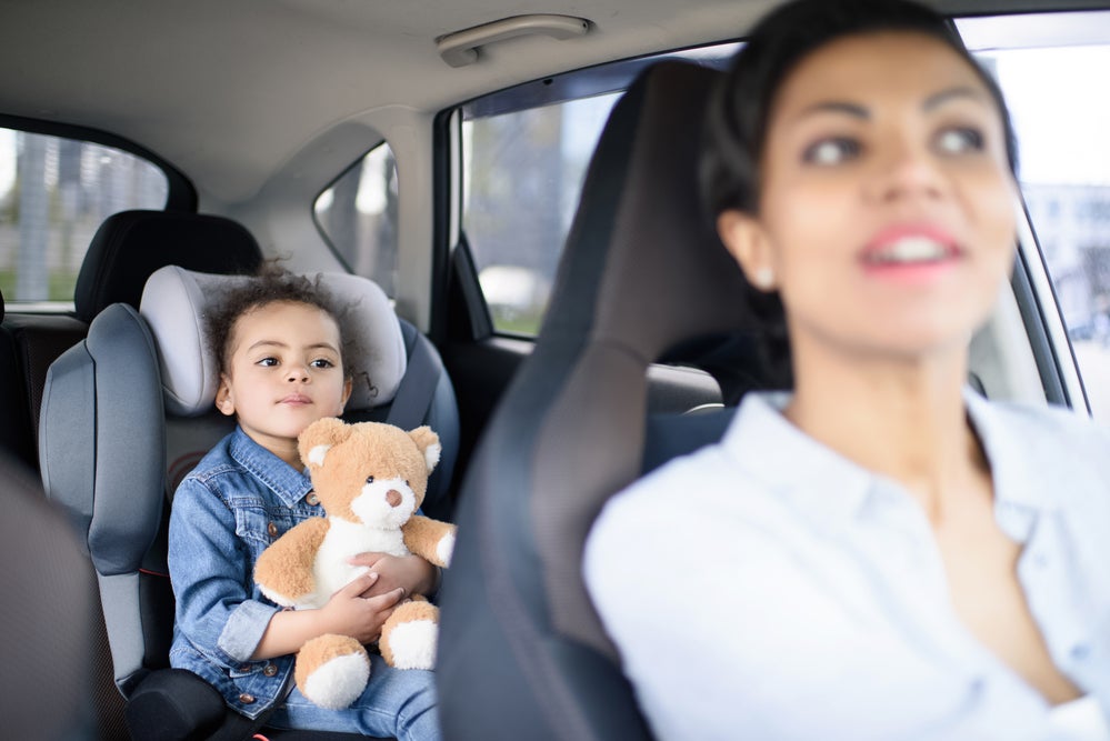 Mom playing game with kid in the car