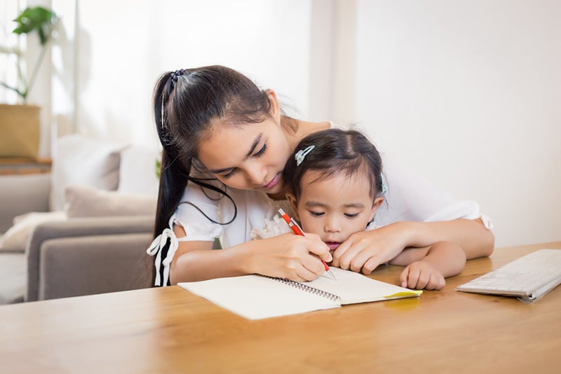 Mother and child working on pre-writing activities together