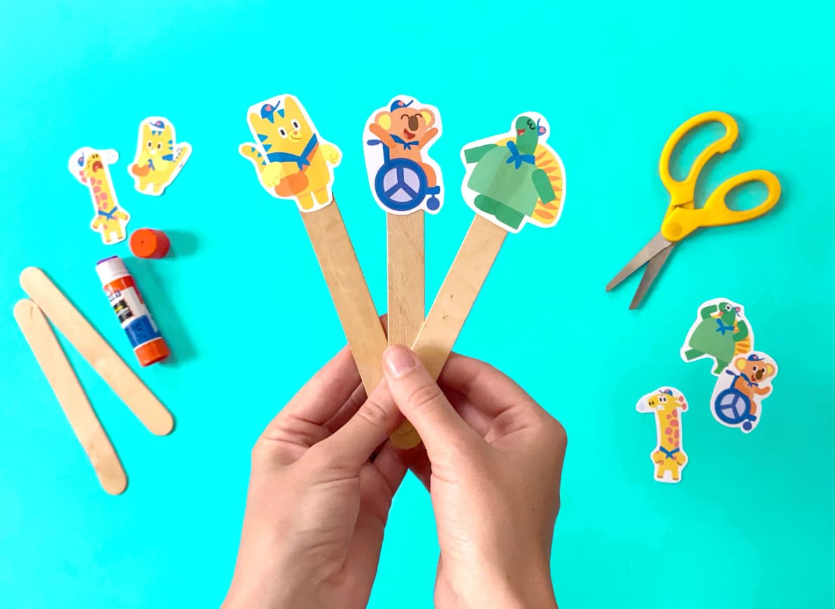 Completed emotion finger puppets; HOMER characters on popsicle sticks