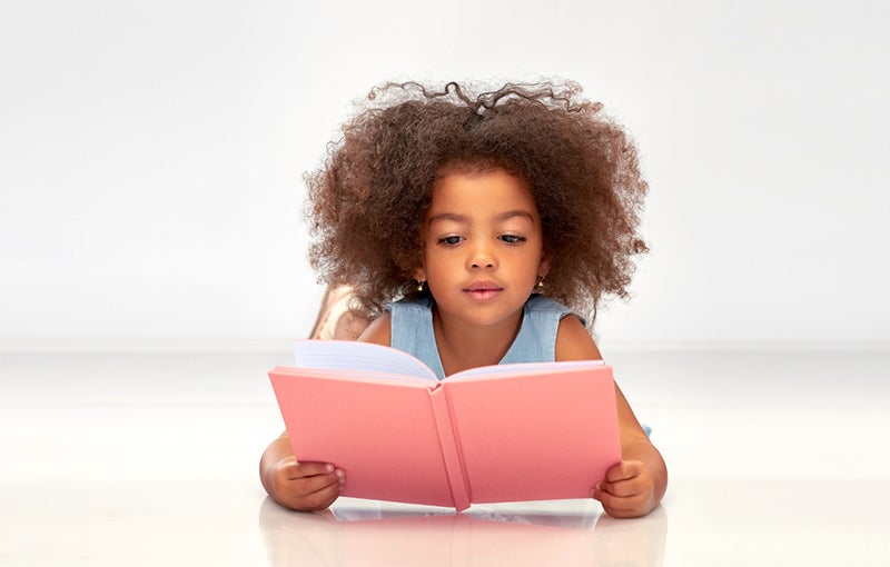 Child practicing decoding - Early reading success