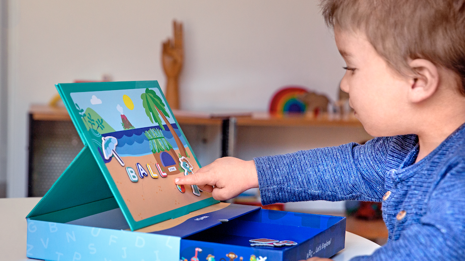 Boy playing spelling games