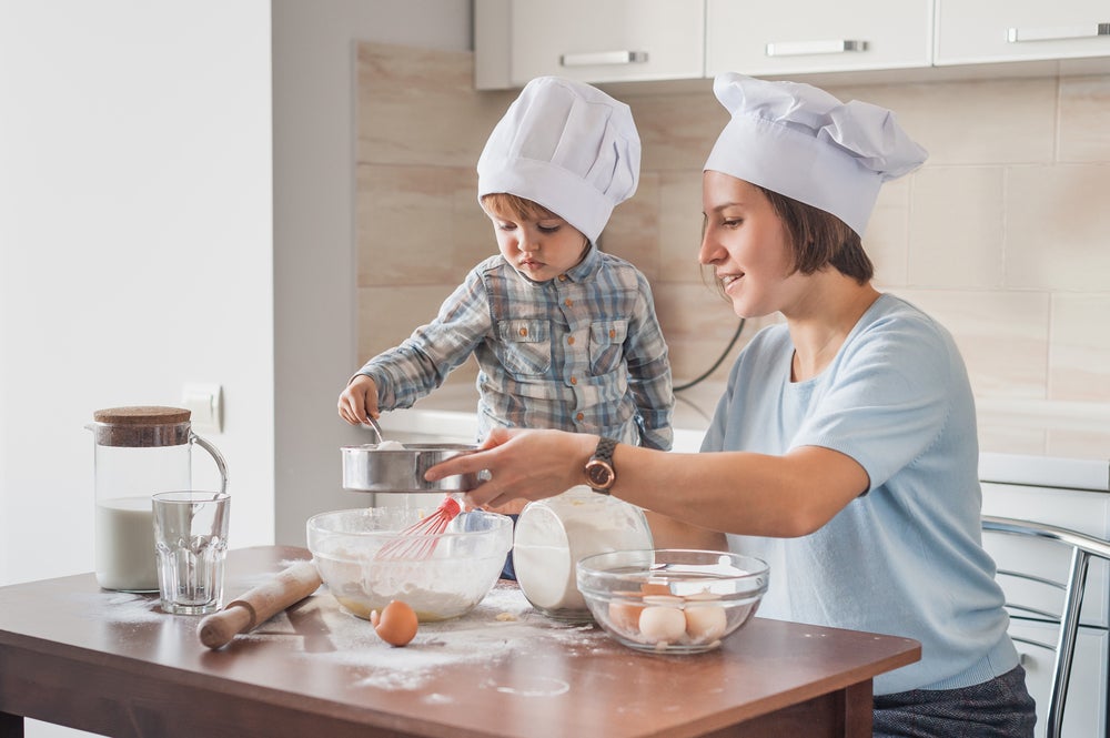 Mother and child cooking together