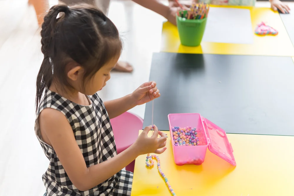 Girl making a gift for a friend