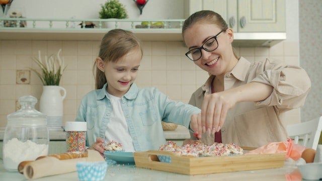 Mom showing daughter age appropriate chores