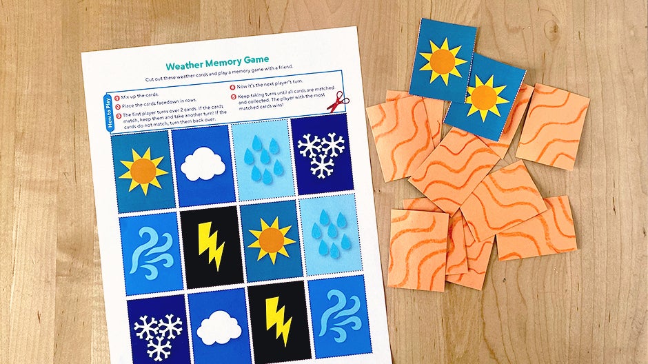 Weather Memory Game printable on table next to cut-out memory game cards