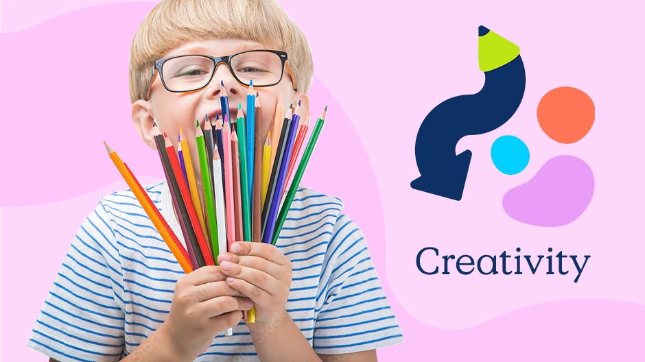 Creativity: Child holding two handfuls of colored pencils