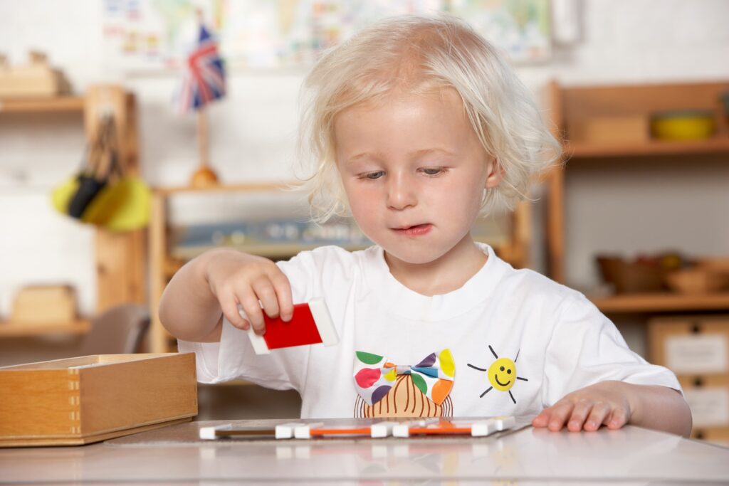 Child focusing while doing pre-K math