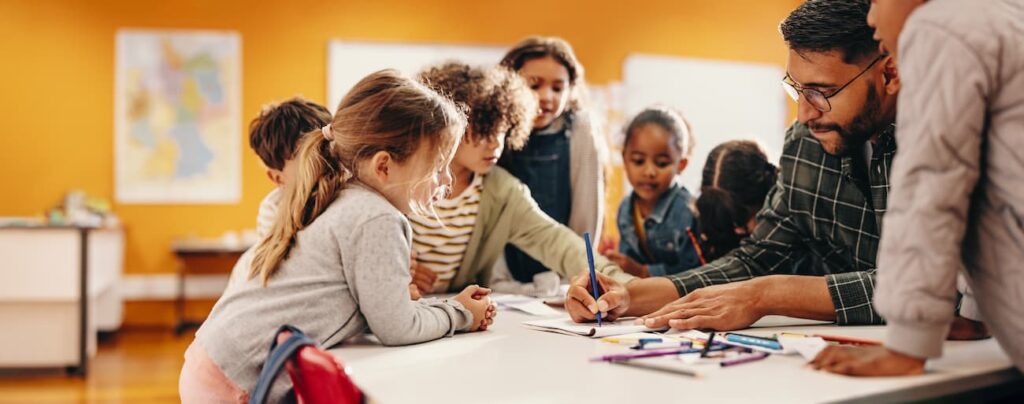 Adult drawing a word for kids