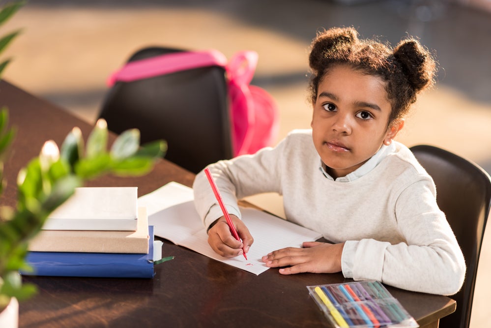 Child working on feeling list SEL activity