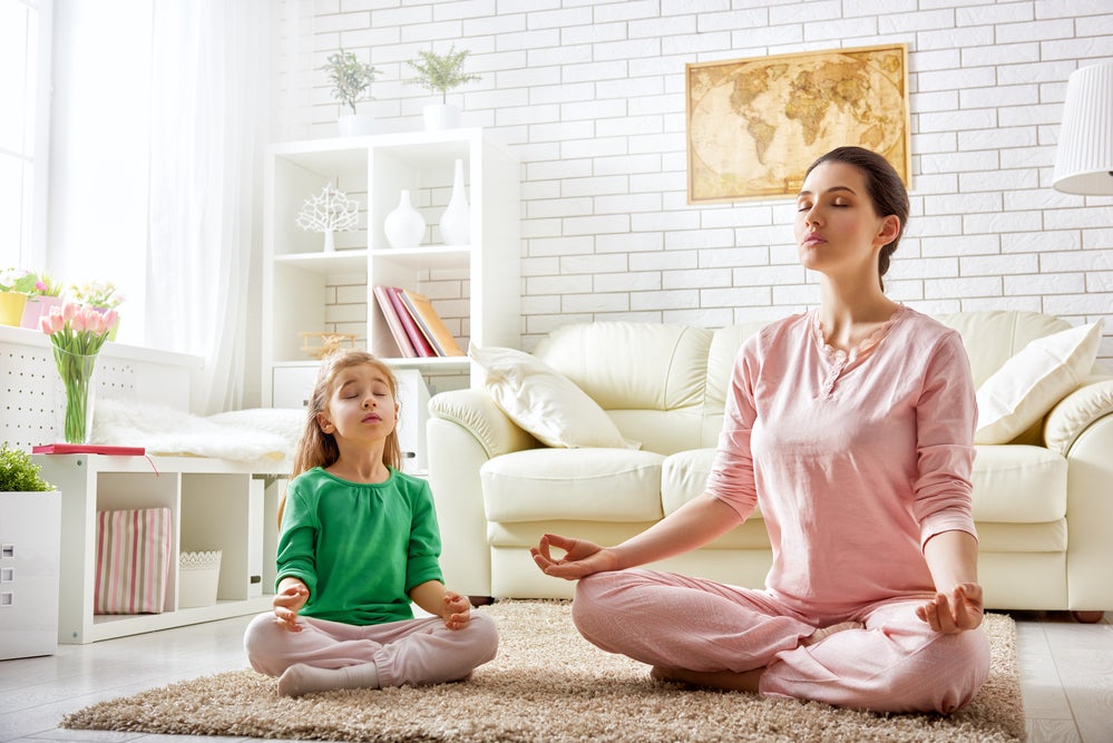 Mother and daughter working on SEL breathing exercises