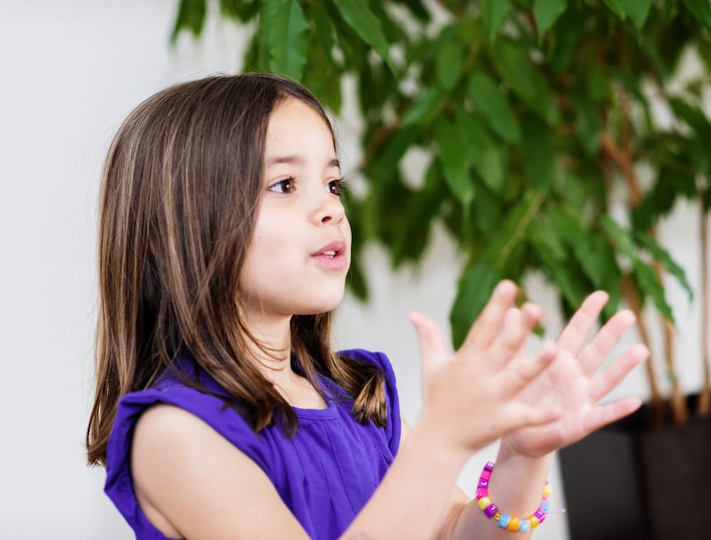 Girl clapping while working on phonemic awareness
