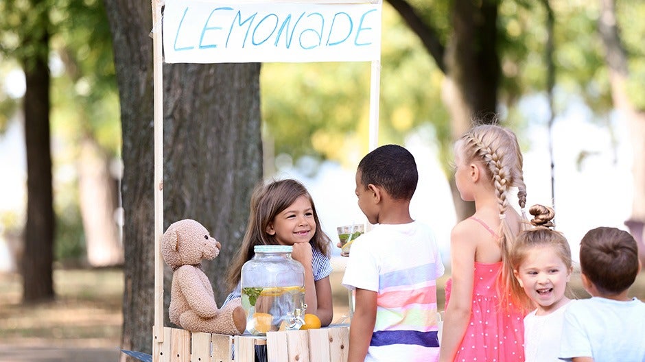 children standing in line with smiling faces