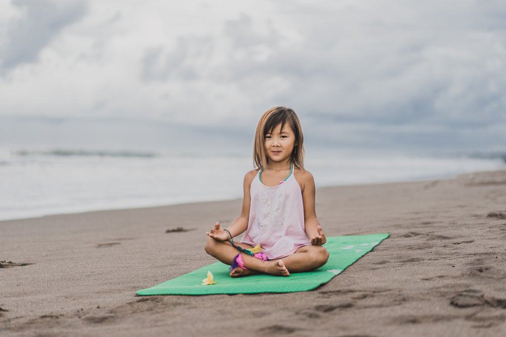 kid doing yoga to deal with emotions