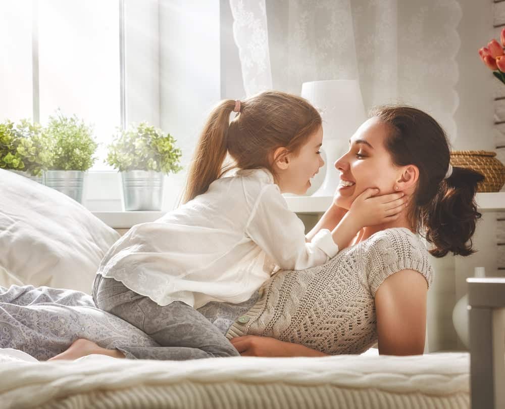 Daughter laughing with mom
