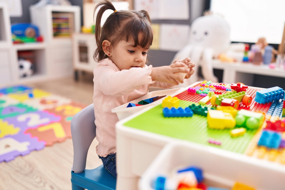 young kid playing with blocks
