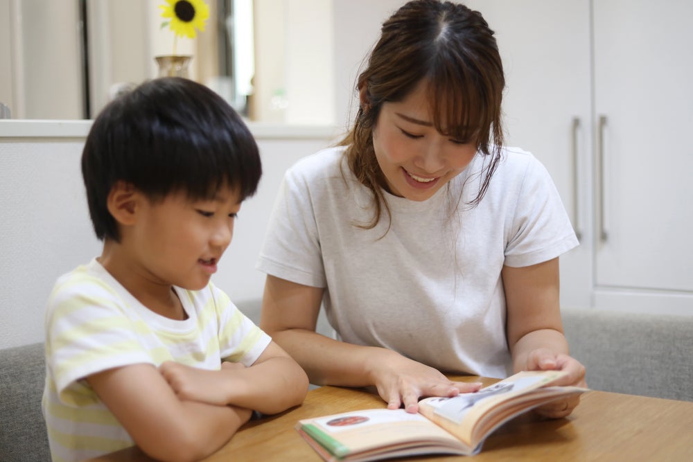 Mom reading with son