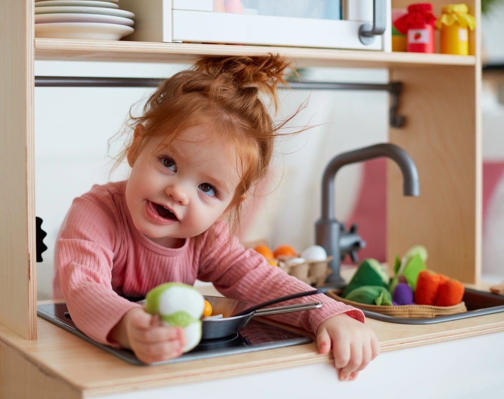kid playing kitchen