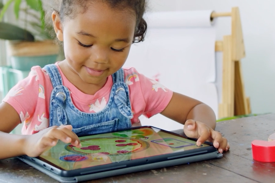 young girl learning words that start with the letter D