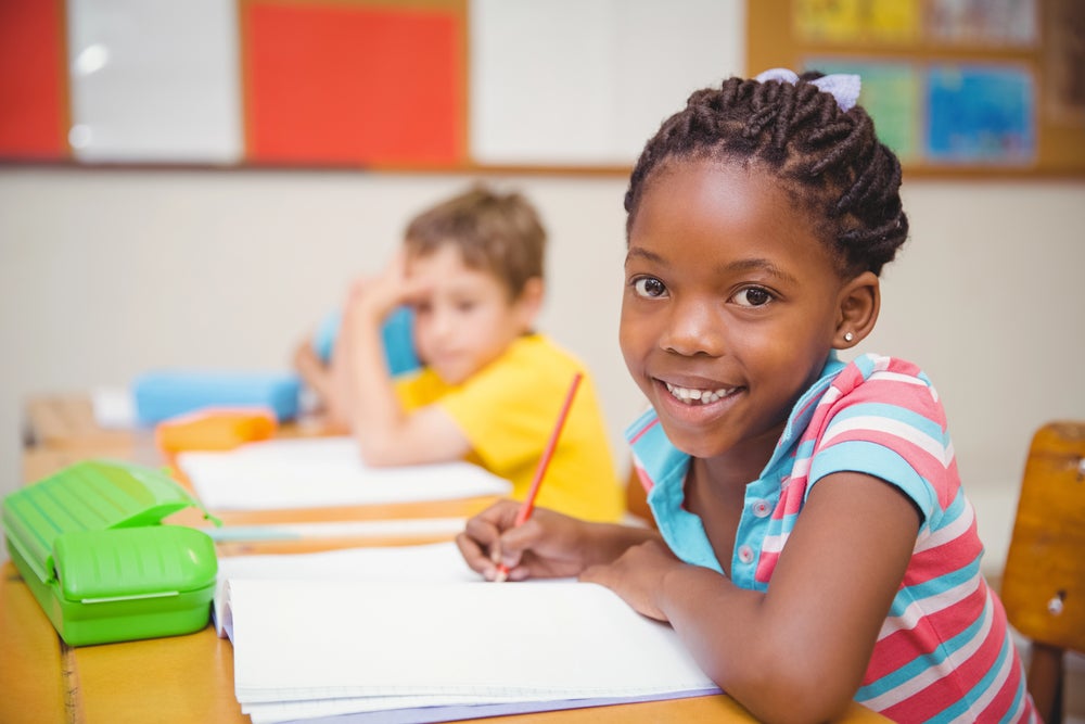 young student practicing rhyming words at school