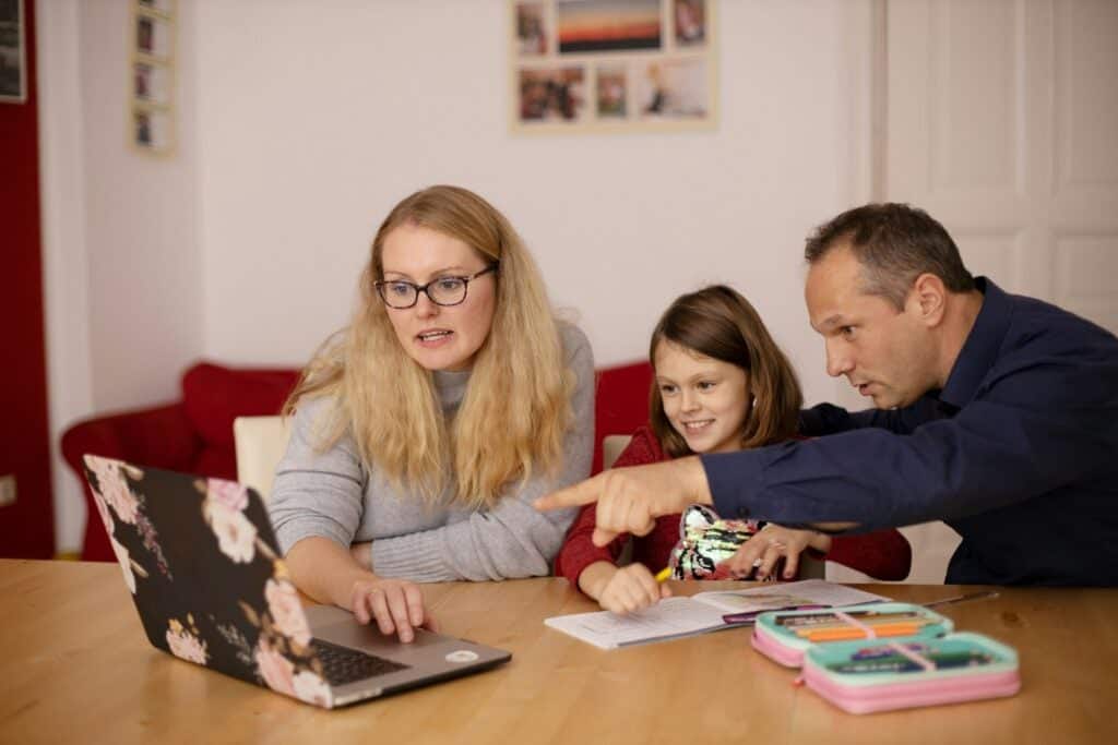 Parents going over the pros and cons of homeschooling